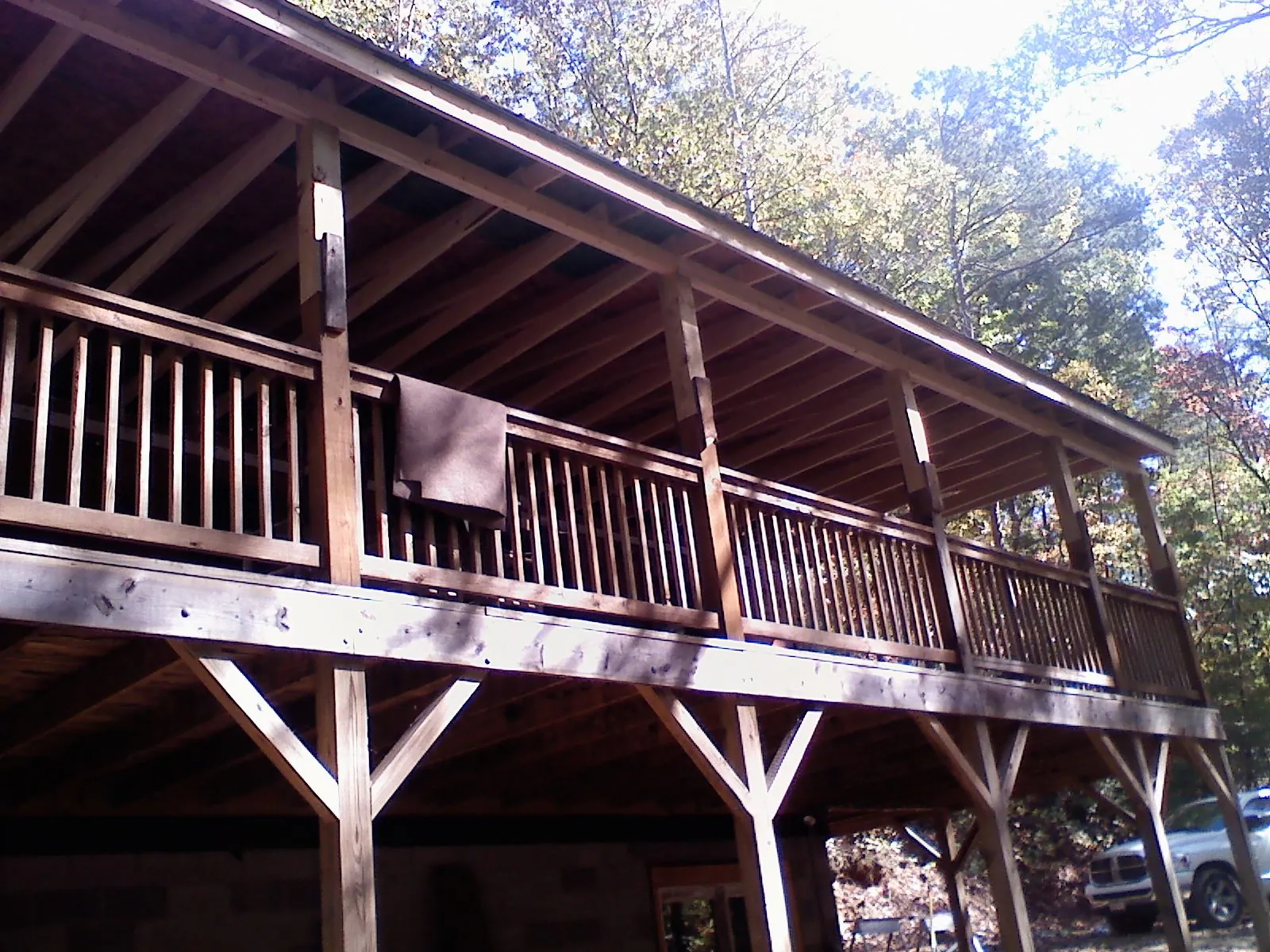 Timber framing under a new elevated porch and deck — Roof Leak Repair in West Simsbury by Roofing Brothers
